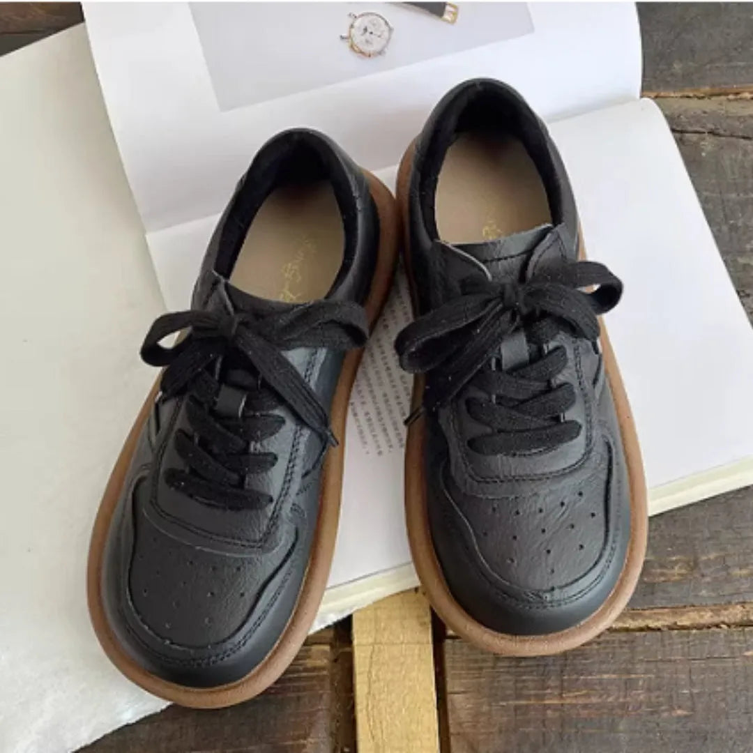 Round-toe cowhide leather lace-up flat shoes in black, soft rubber sole