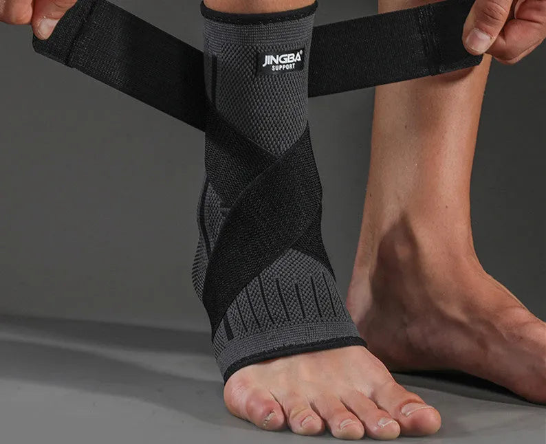 Adult sports ankle support in black colour shown, suitable for basketball and running.