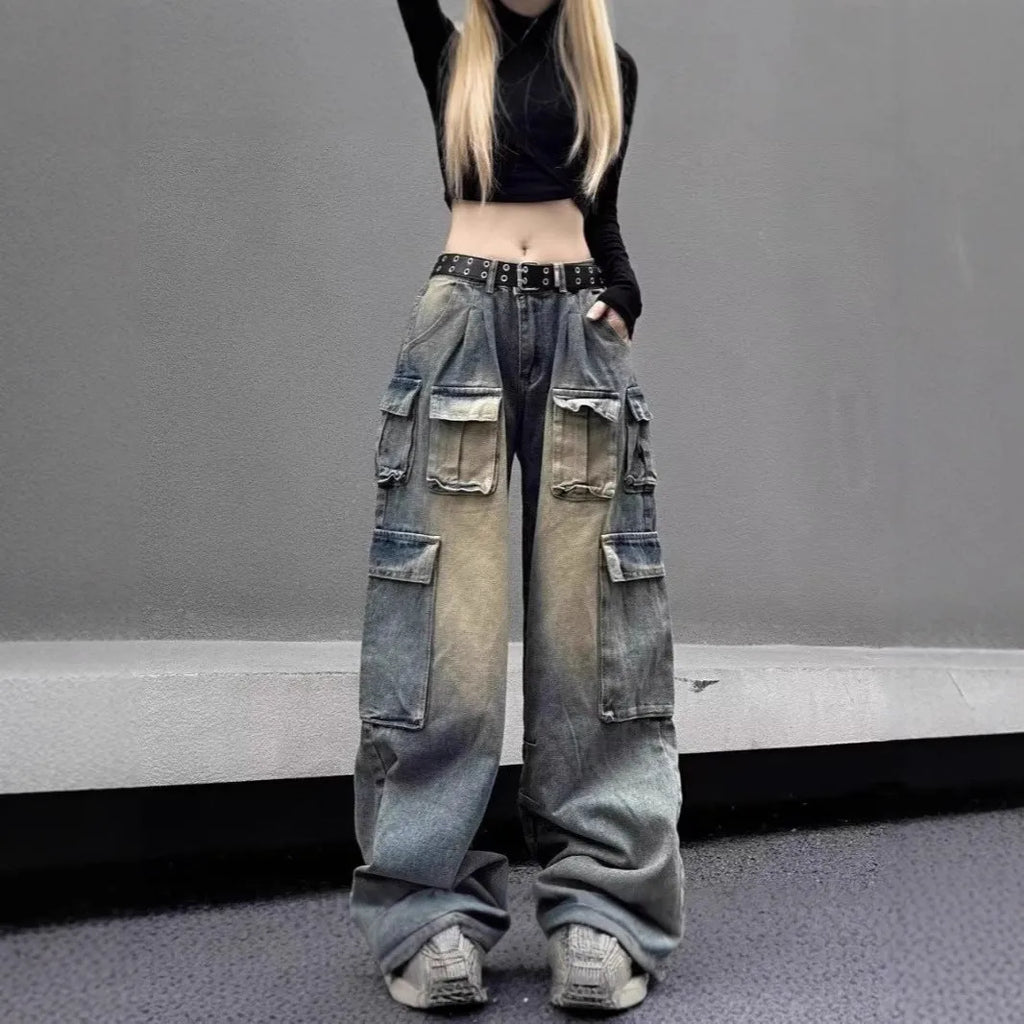 Loose-fit distressed denim jeans with multiple pockets in light blue wash, straight-leg street hipster style