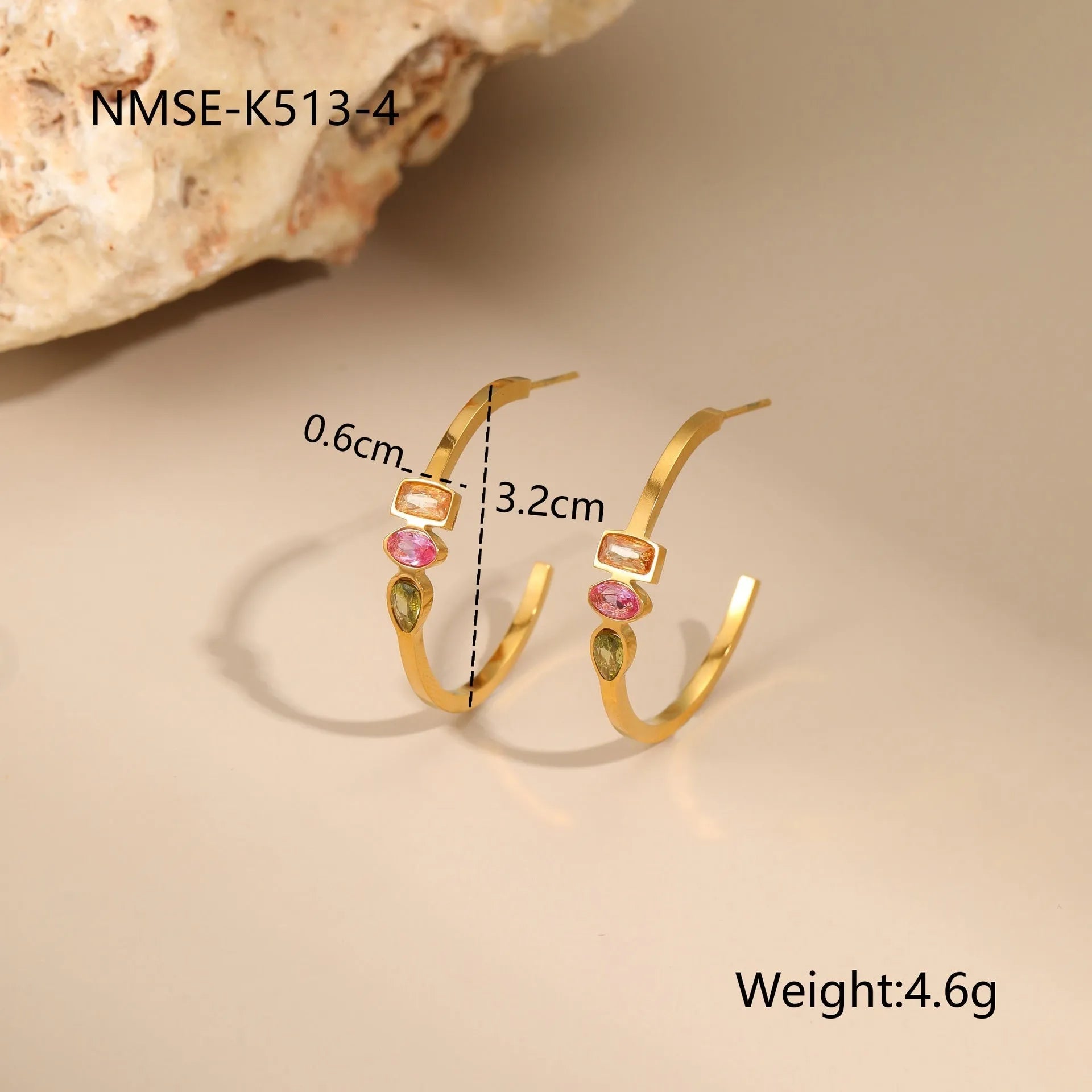 Geometric gold-plated jewellery set with necklace, earrings, and ring on display