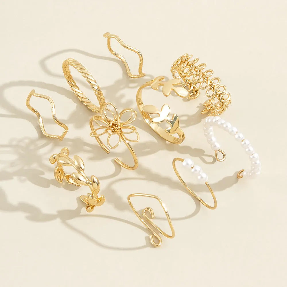 Openwork flower set ring with glossy gold finish showing floral pattern detail