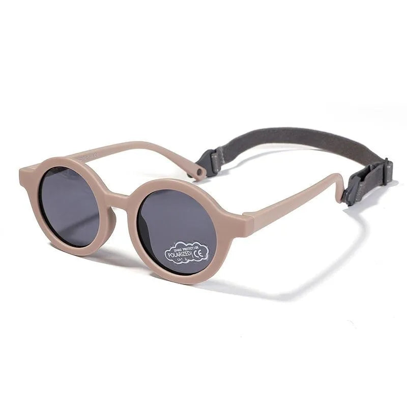 Children's round sunglasses for 0-3 year olds with UV400 protection, shown in a selection of colours.