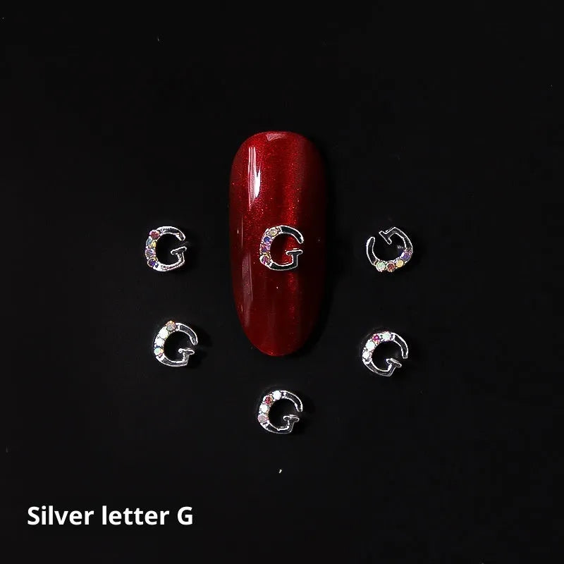 Gold alloy letter A nail ornament charm with crystal detail on a square chain base
