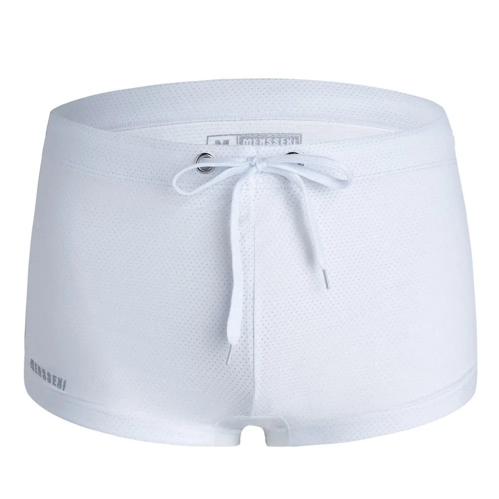 Men's low-waist boxer style swimming trunks with lace detailing in nylon fabric