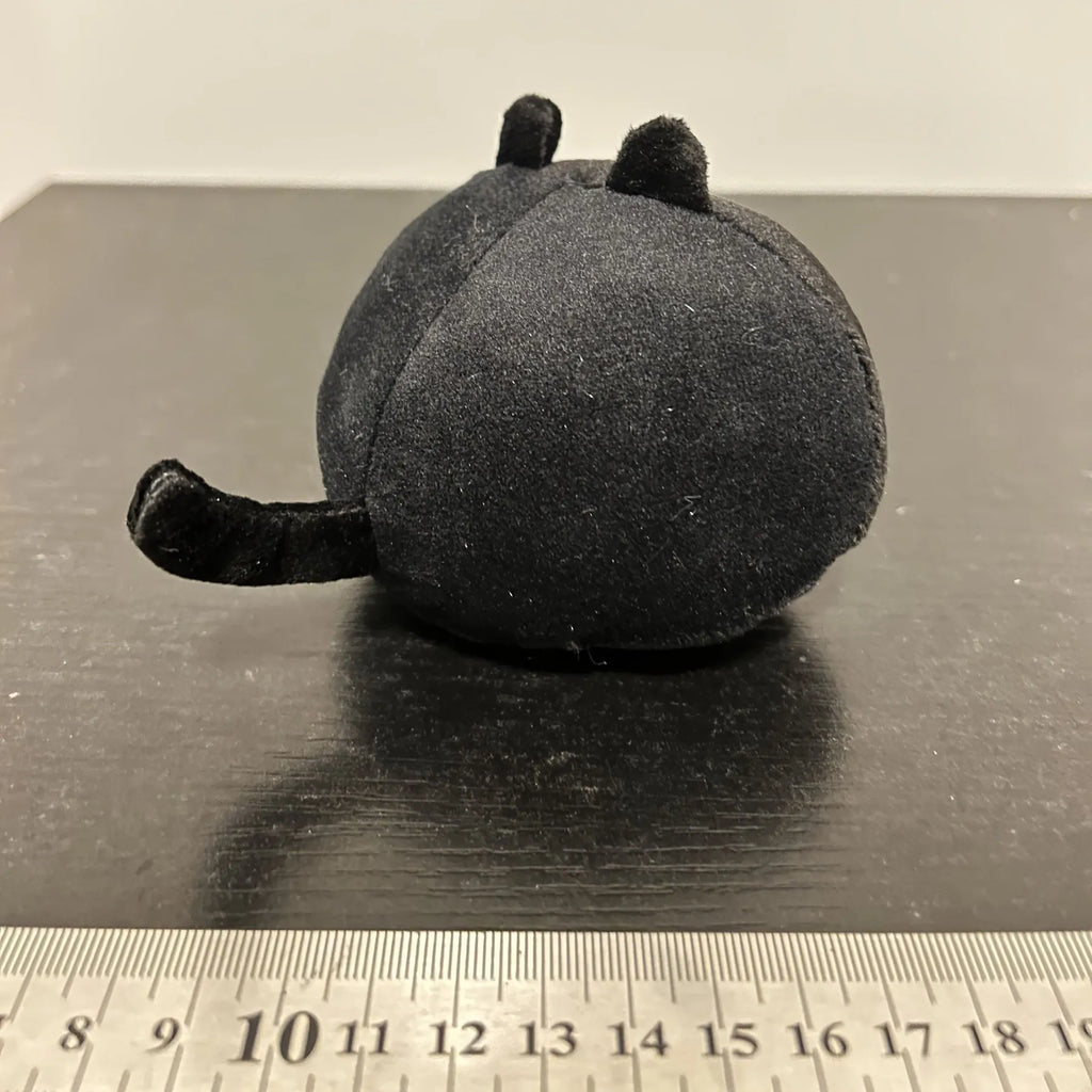 Fluffy black cartoon cat plush toy, 28cm tall, on a neutral background.