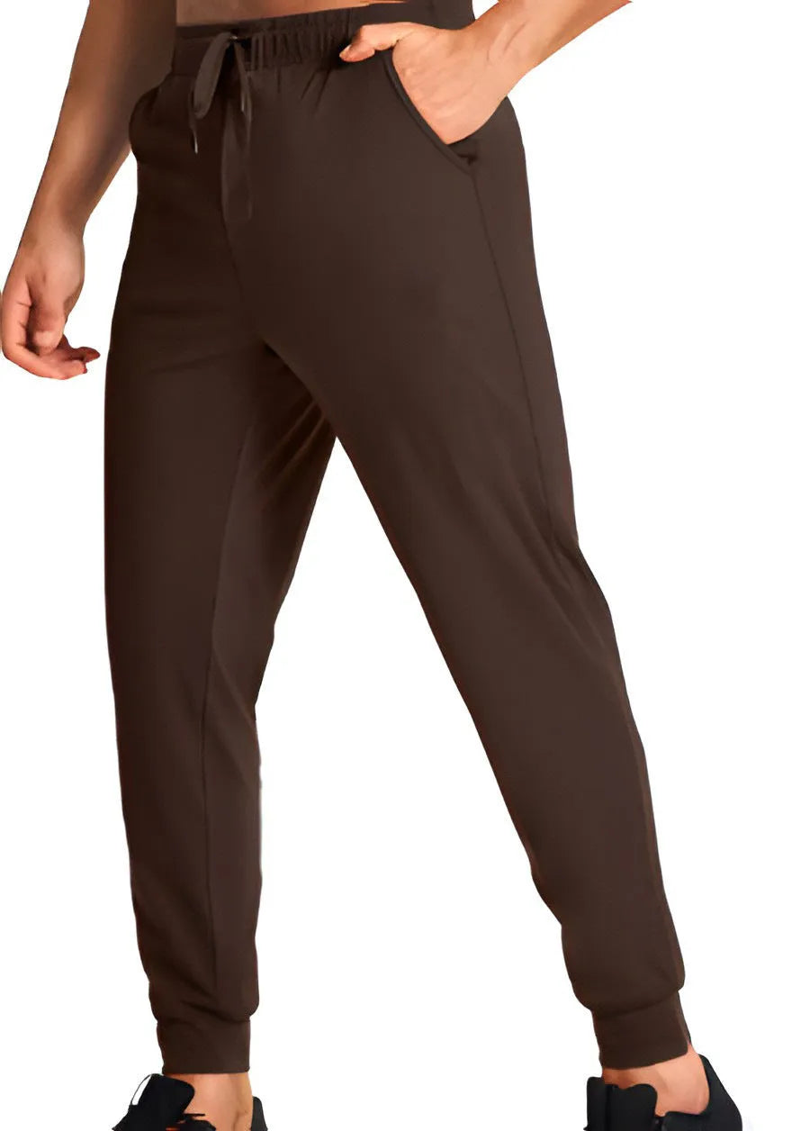 Men's loose-fit solid colour casual trousers made from polyester fabric on a hanger.
