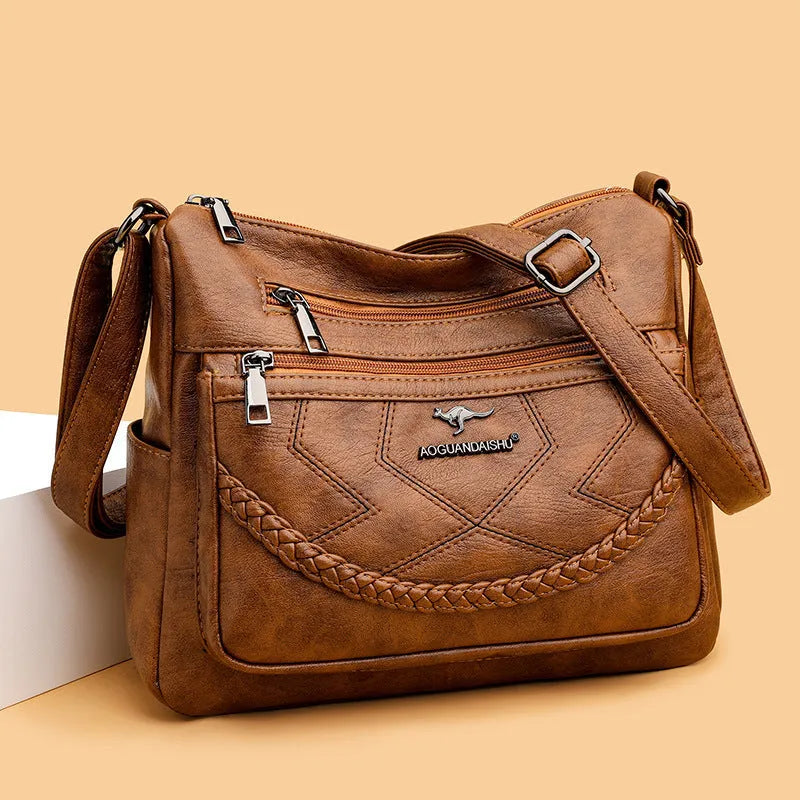 Women's black PU leather crossbody shoulder bag with large capacity and zipper compartment