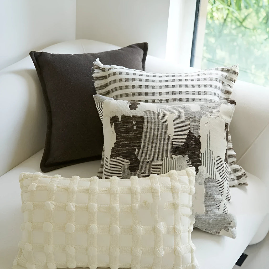 Coffee brown striped mid-century sofa cushion in Chinese classical style on a grey sofa.