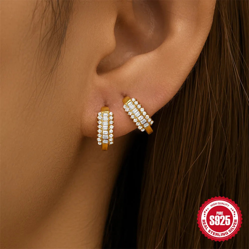 Small round geometric sterling silver stud earrings in gold and silver electroplated finishes.