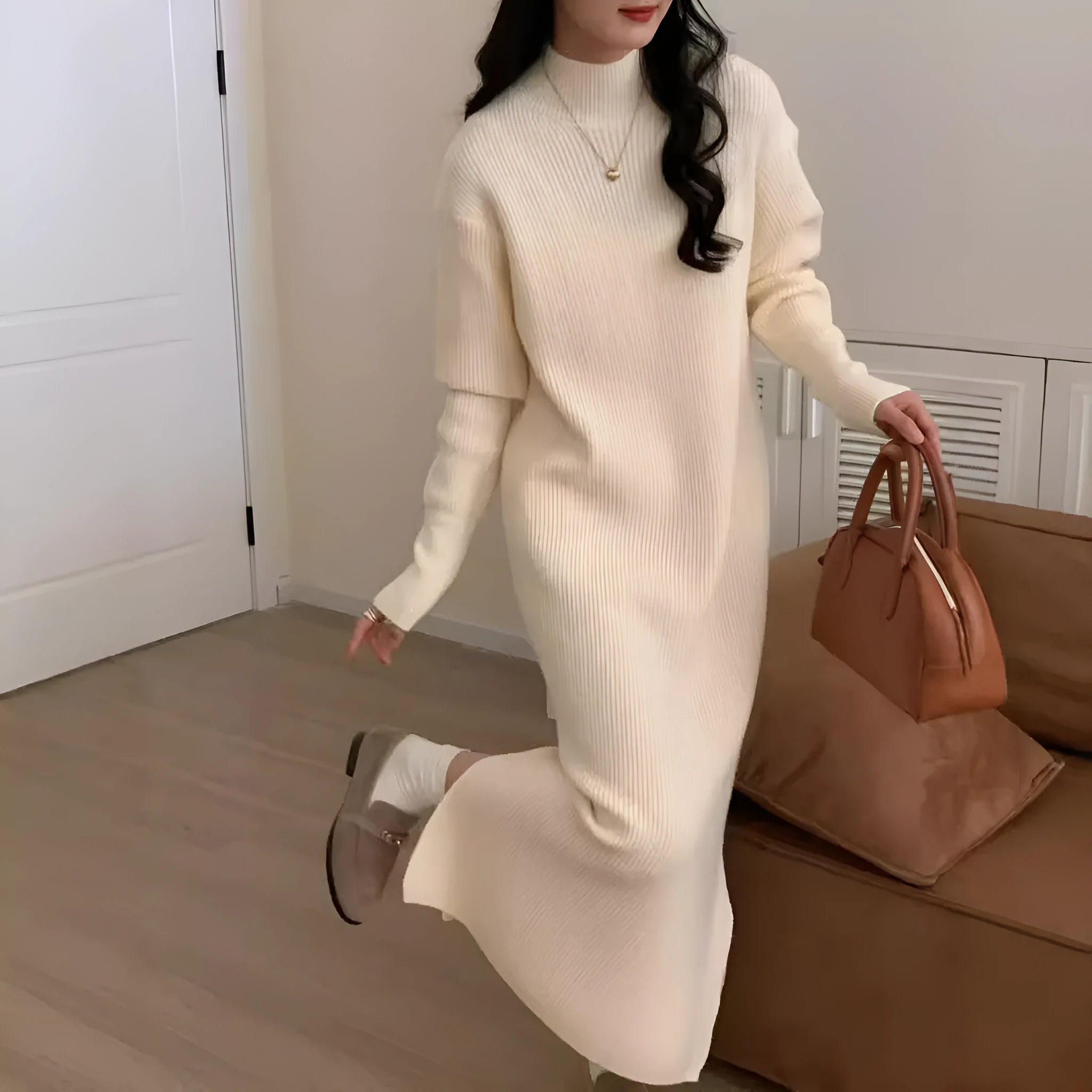 Women's knitted half turtleneck dress in acrylic with long sleeves and a high-waisted midi skirt.