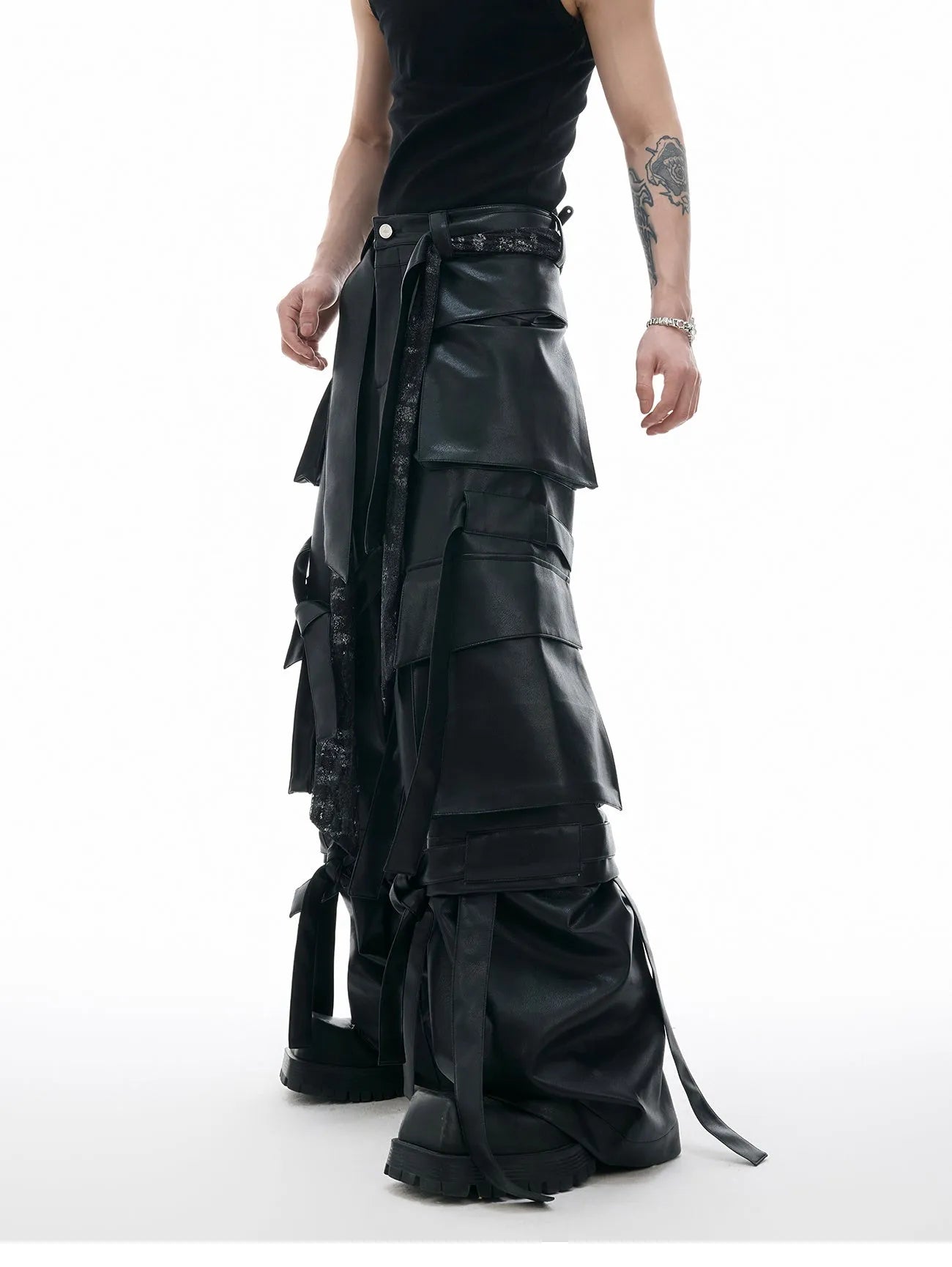 Black loose fit retro pants with multiple pockets, quilted stitching details and ribbon trim