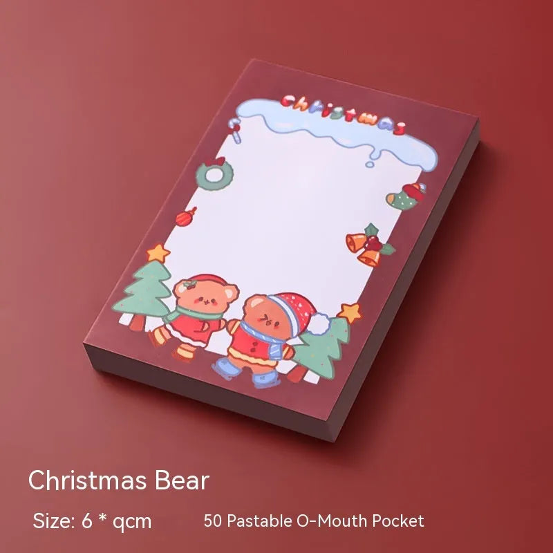Christmas sticky notes pad with festive designs including elf, gift, sled, Santa Claus, bear, and snowman