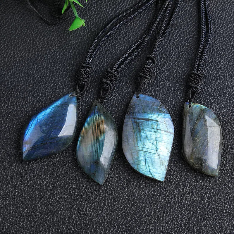 Natural labradorite leaf pendant necklace with blue moonlight effect on white background