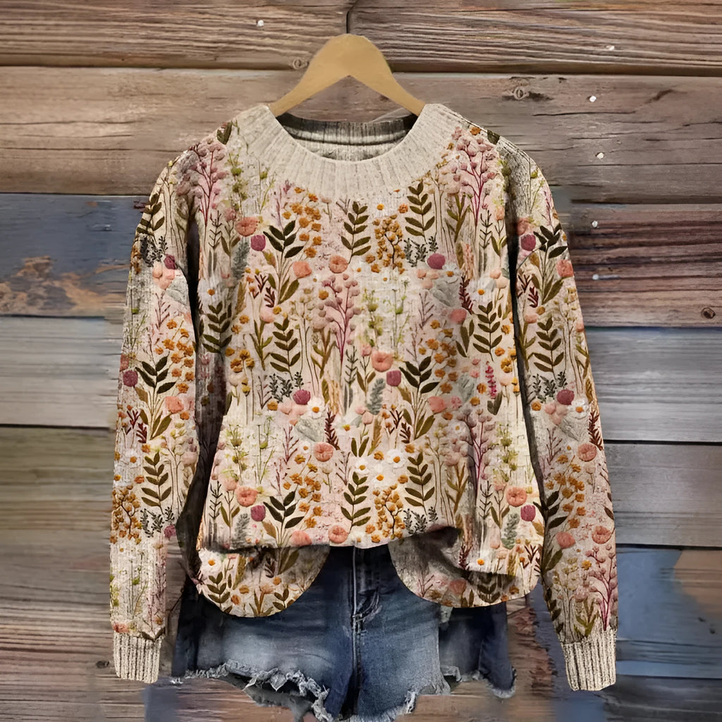 Little flower digital print on a round neck polyester sweater, shown on a hanger.
