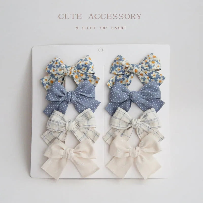 Children's cloth hairclips with dovetail bow decoration in multiple colour options