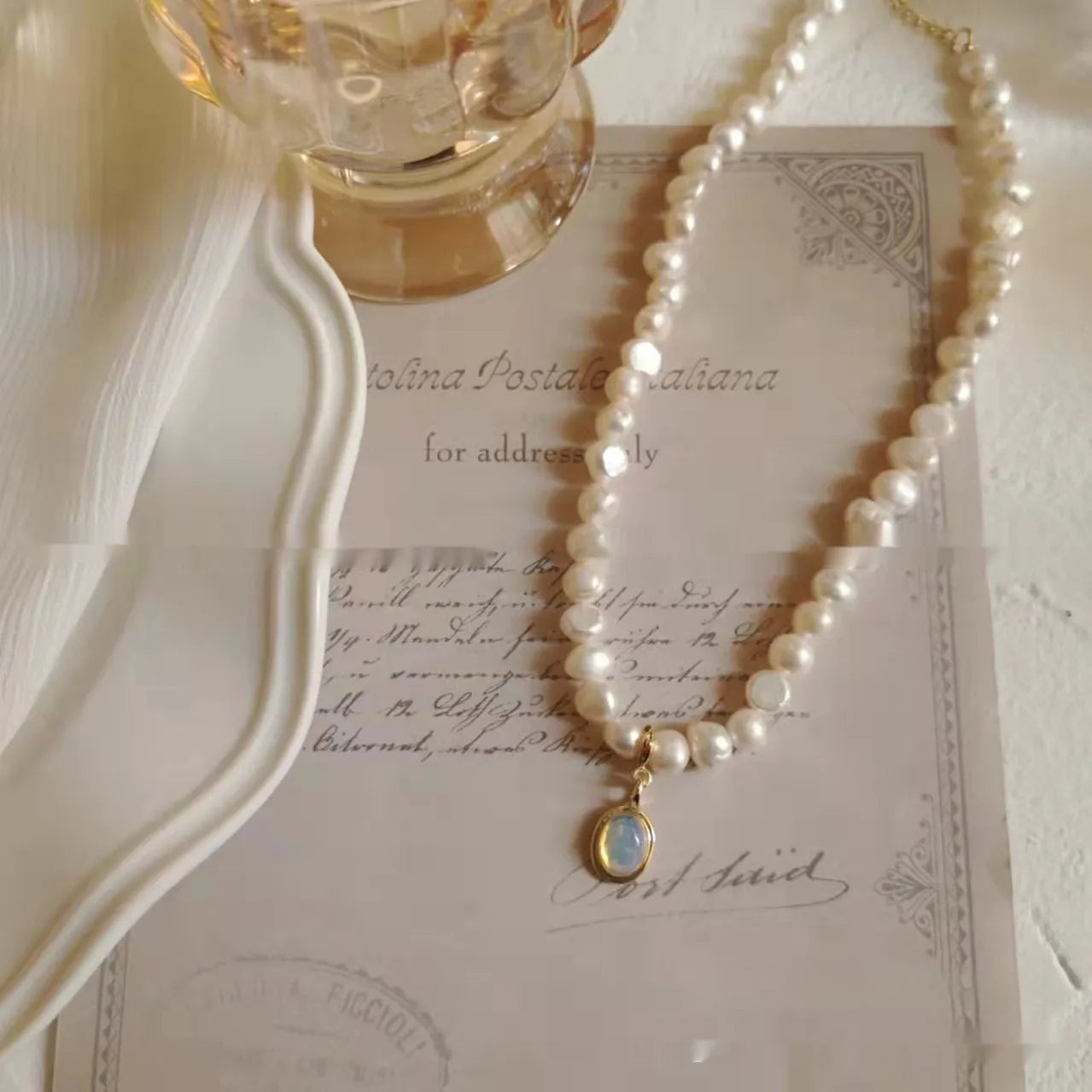 French Court style vintage pearl necklace with geometric shapes on an adjustable metal chain.