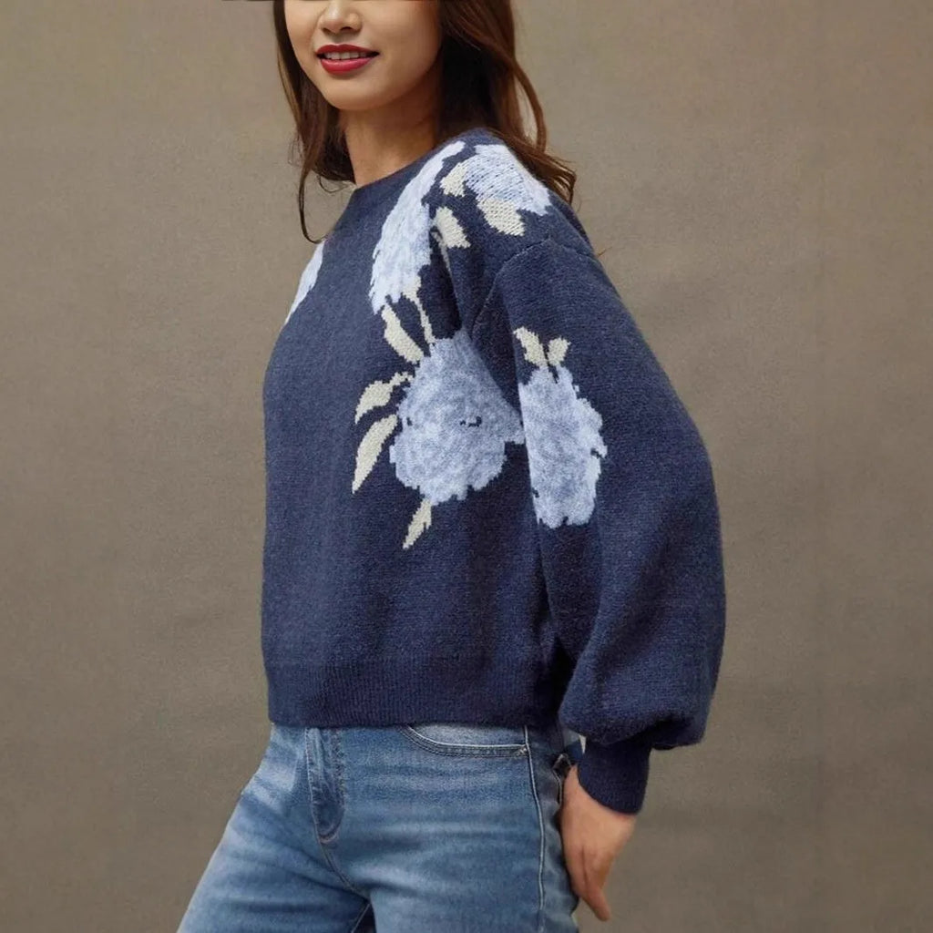 Sapphire blue women's loose pullover with a raised floral jacquard pattern and long sleeves.