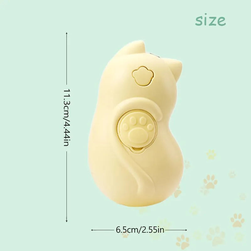 Cat Steamy Brush 3-in-1 pet grooming tool with steam spray function on a table.