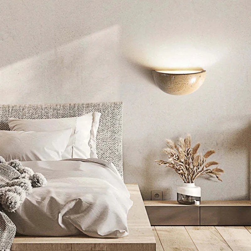 Retro marble semicircle wall lamp with adjustable LED light on a stone wall
