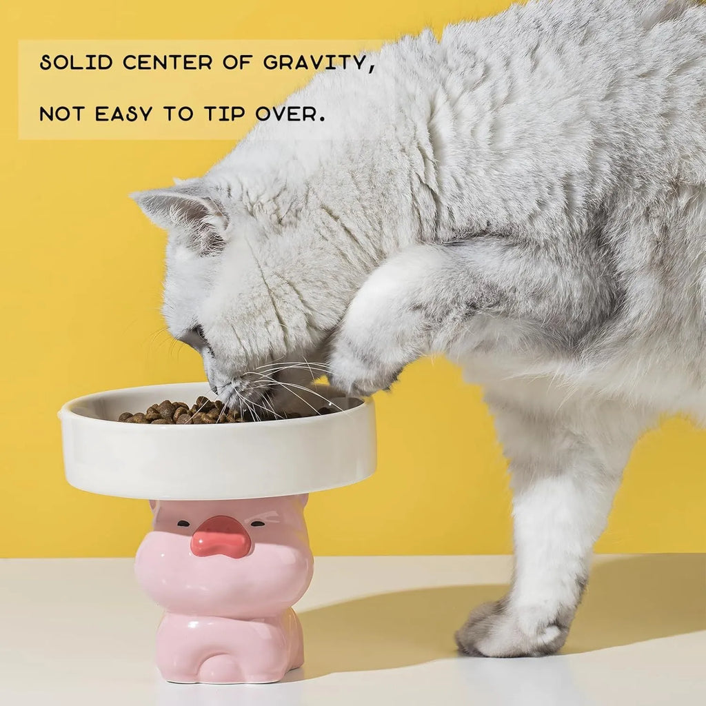 Raised ceramic cat bowl in animal design, showing elevated feeder stand and wide food bowl opening.