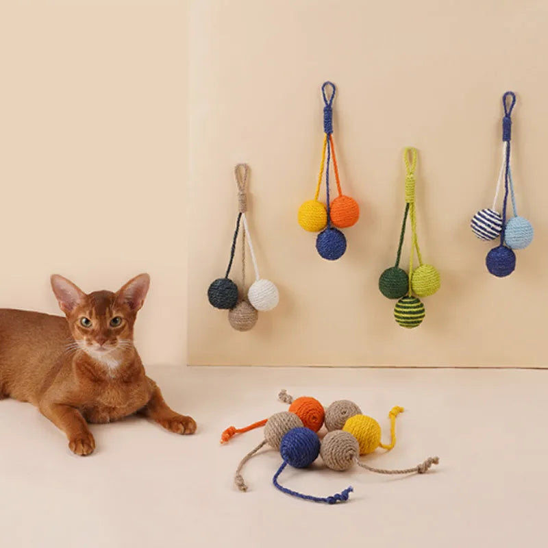 Cat toy set with teaser stick and coloured catnip balls on white background