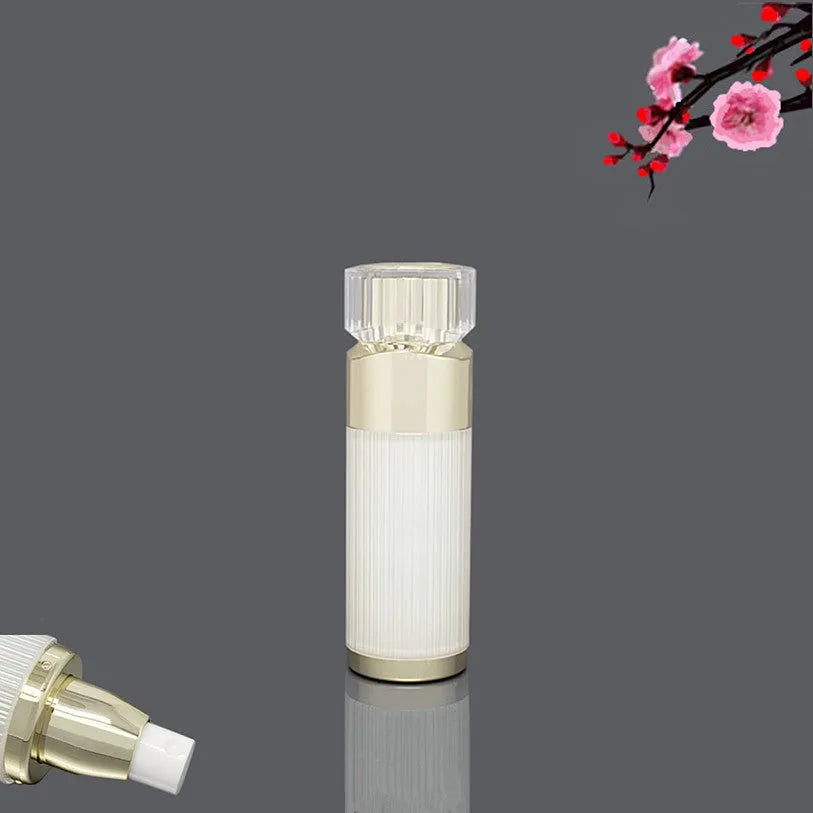 Acrylic cosmetics sub-bottling box with champagne gold and brushed white empty bottles in various sizes