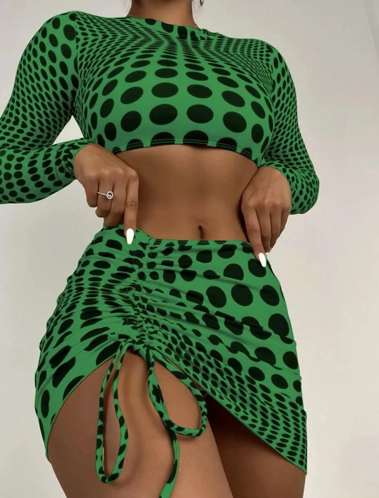 Women's green polka dot swimsuit three-piece set with matching top and skirt