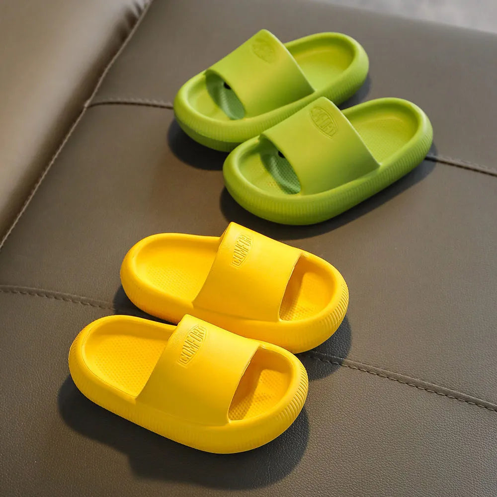 Children's bright coloured EVA slippers with non-slip soles in blue, green, orange, pink, and yellow.