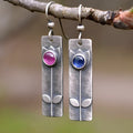 Geometric antique finish earrings with red sapphire detailing and electroplated metal construction