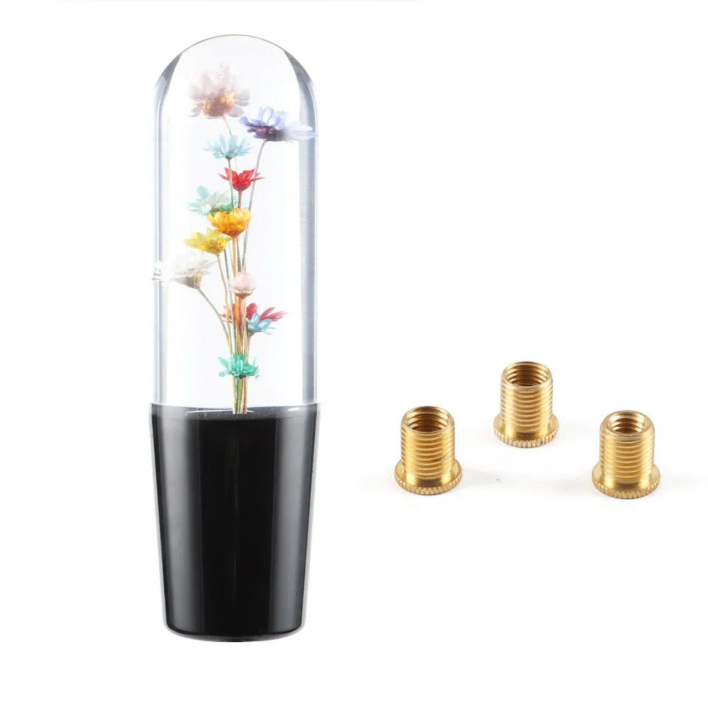 Transparent crystal car gear shift knob in assorted colours with three metal adapters.
