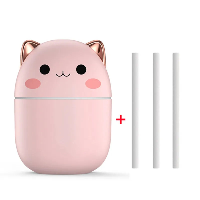 Cute cat-shaped USB air humidifier with LED cool mist spray in white, for office and bedroom use.