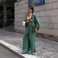Women's green cotton thermal sweater with zipper and stand collar on model