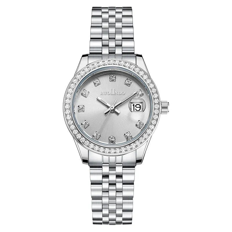 Women's silver calendar watch with circular dial showing date function and stainless steel buckle