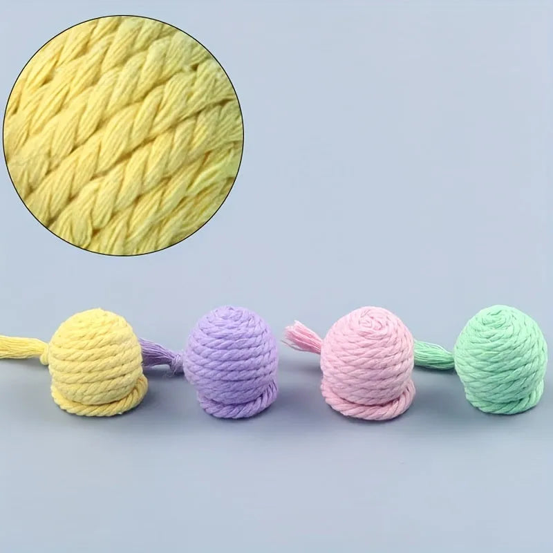 Colourful cat toy ball with rope and built-in bell available in green pink purple yellow for kittens