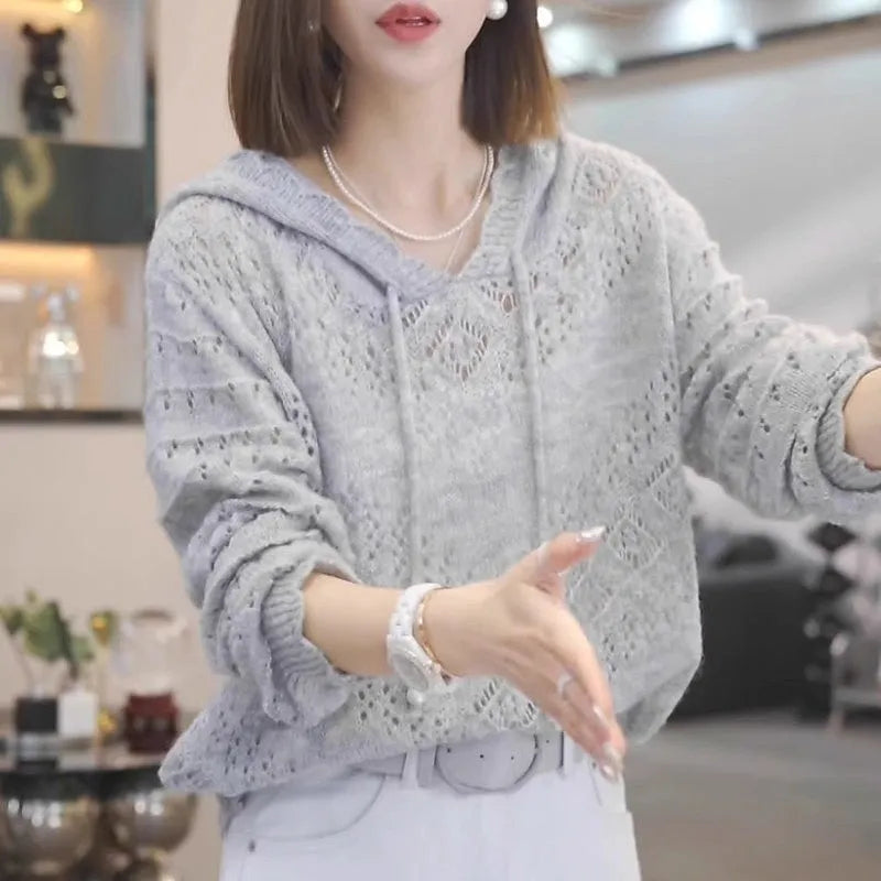 Women's loose-fitting crochet hollow knit hooded longsuit undershirt in a solid colour.