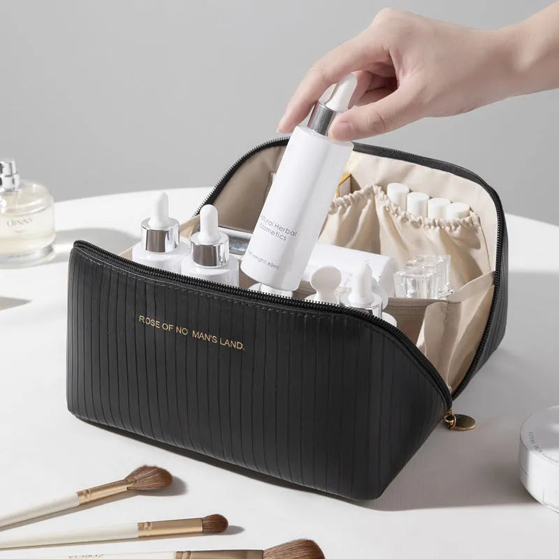 Beige cubic PU vertical pattern pillow makeup bag for travel, showing dimensions of 22.5cm by 12.5cm.