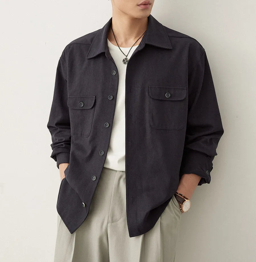 Men's long sleeve lapel shirt in light sand rice colour, showing collar detail and stitching.
