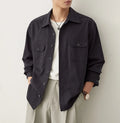 Men's long sleeve lapel shirt in light sand rice colour, showing collar detail and stitching.