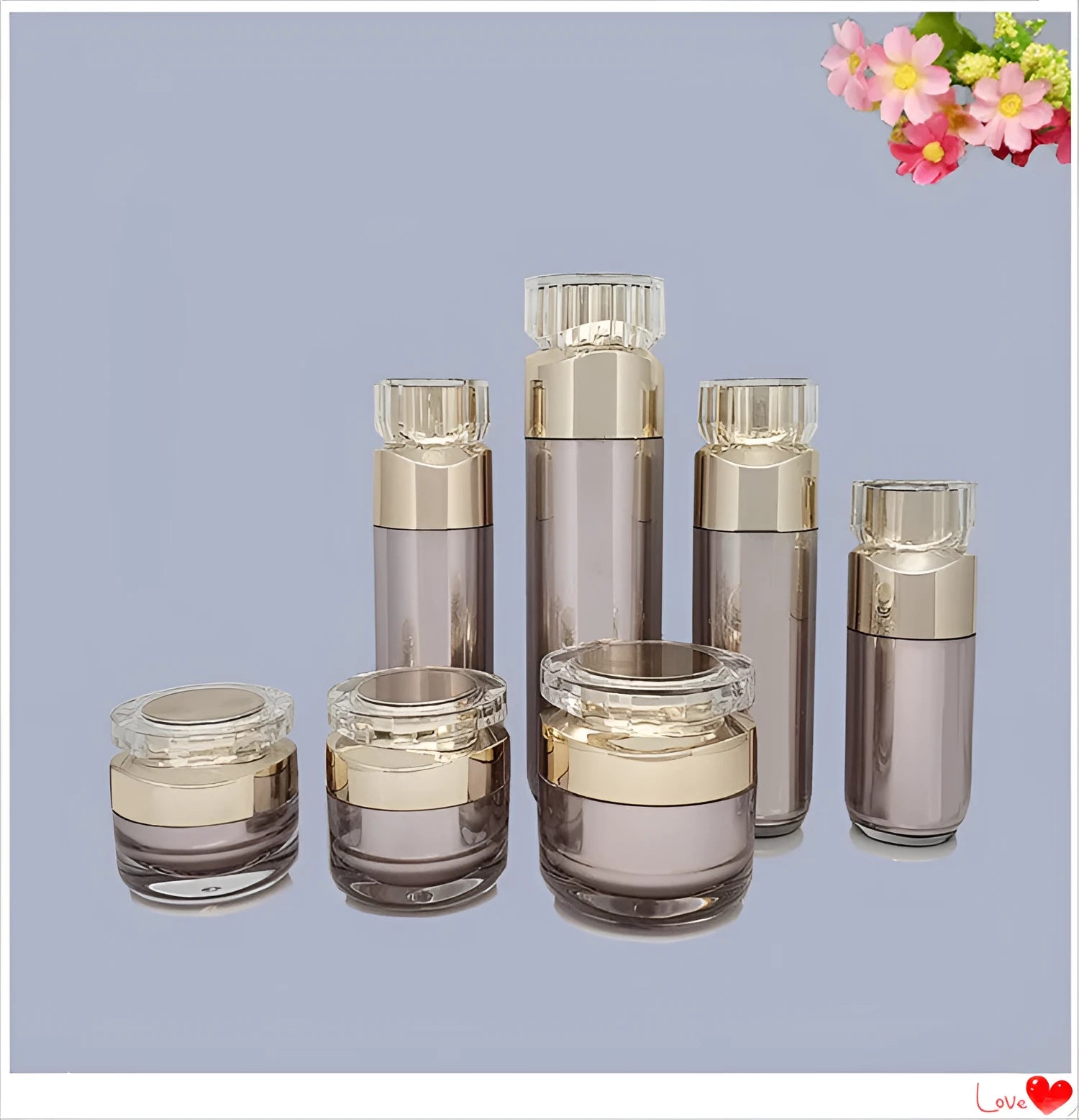Acrylic cosmetics sub-bottling box with champagne gold and brushed white empty bottles in various sizes