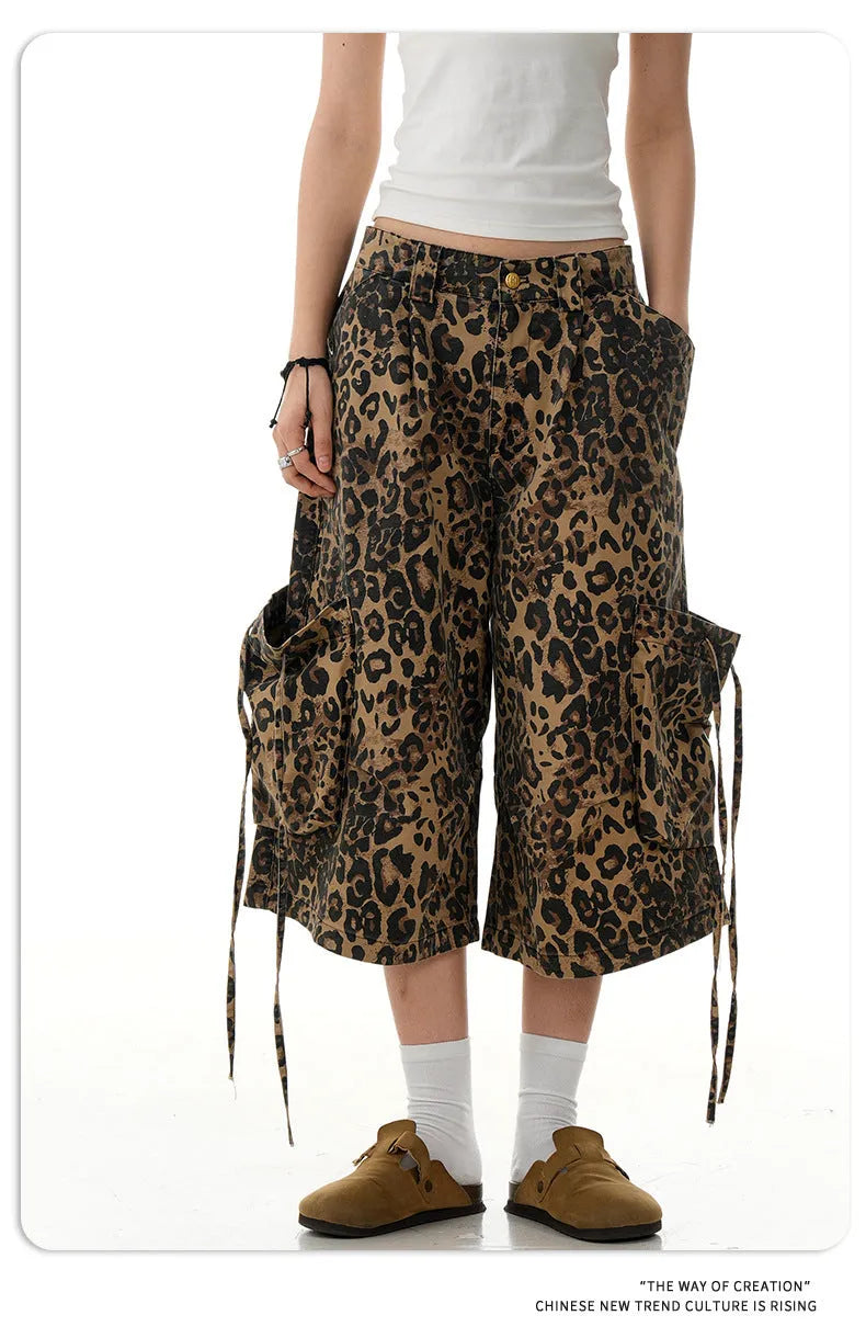 Women's loose straight cropped pants in a leopard print pattern with a high waist and button fly.