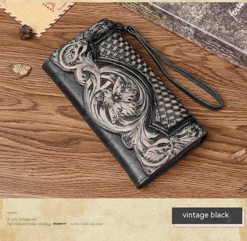 Women's brown tri-fold leather wallet with embossed floral pattern showing open compartments