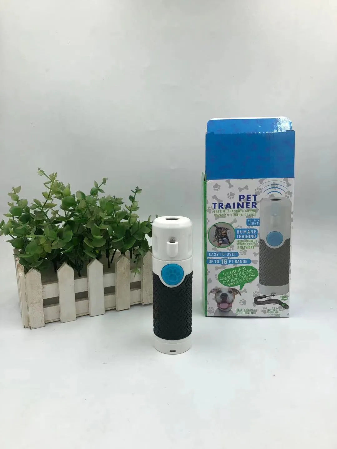 White ABS plastic handheld ultrasonic dog bark trainer device for canine behaviour correction