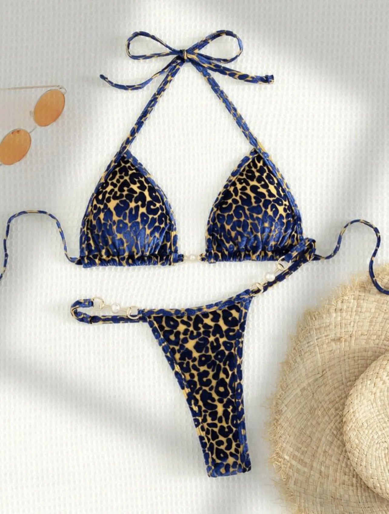 Women's blue leopard print T-shaped bikini swimsuit made from polyester and spandex fabric.