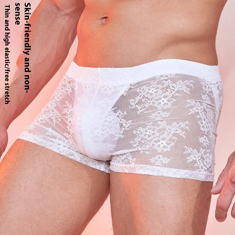 Men's black lace boxer shorts made from nylon fabric, laid flat.