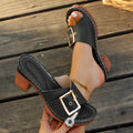 Women's black retro slippers with a chunky block heel and silver metal buckle closure