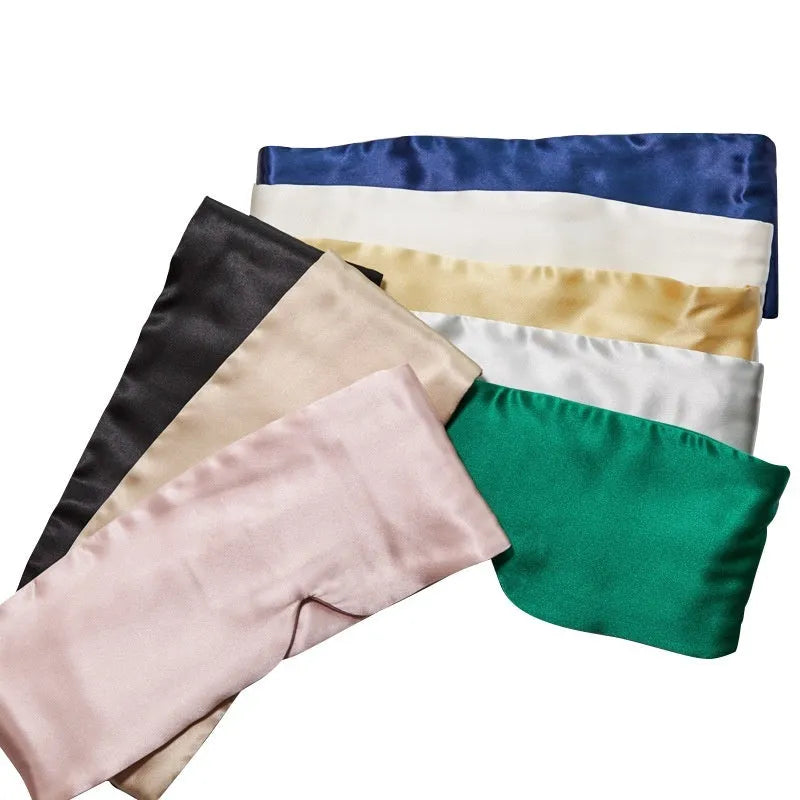 Mulberry silk sleep eye mask shown in multiple colours: black, gold, blue, grey, white, pink, and green.