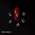 Gold alloy letter A nail ornament charm with crystal detail on a square chain base