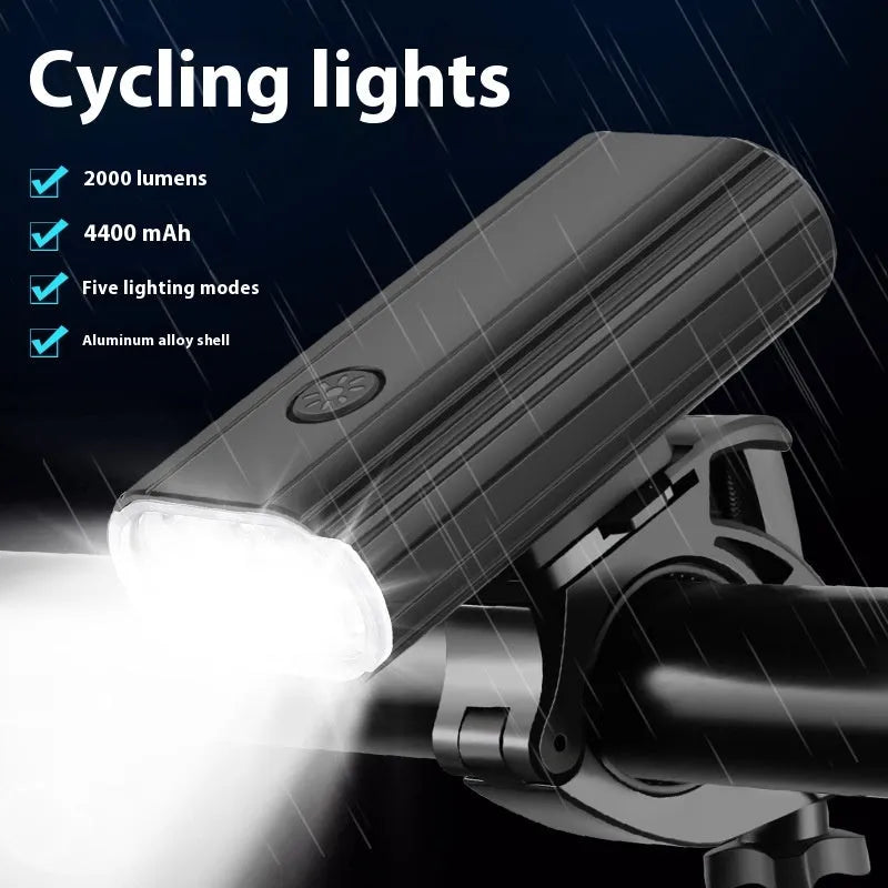 Aluminium alloy bicycle front light with 6 LEDs, USB Type-C port, and quick-release mount on handlebars.