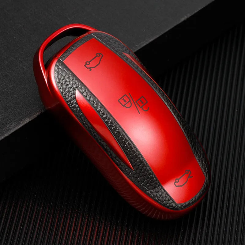 TPU key case with leather pattern finish and carabiner clip in four colour options: red, blue, silver, green