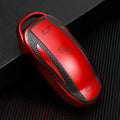 TPU key case with leather pattern finish and carabiner clip in four colour options: red, blue, silver, green